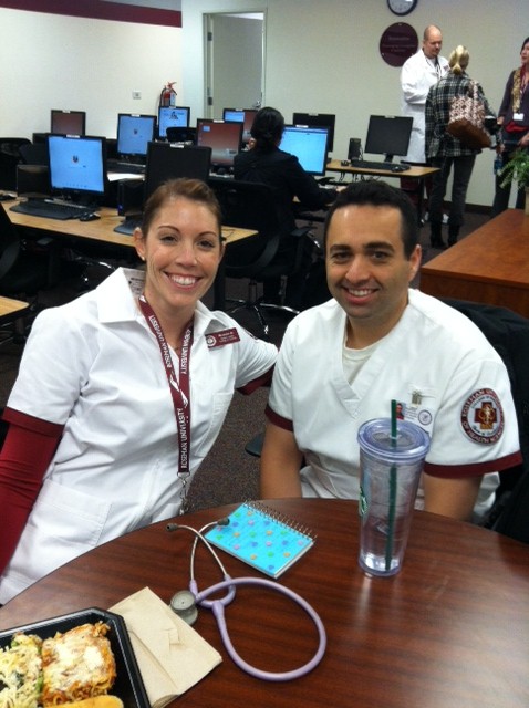2 Roseman nursing students smiling in computer lab